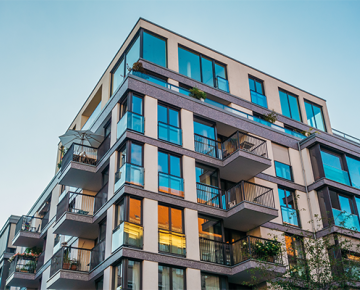 condo building set against the blue sky